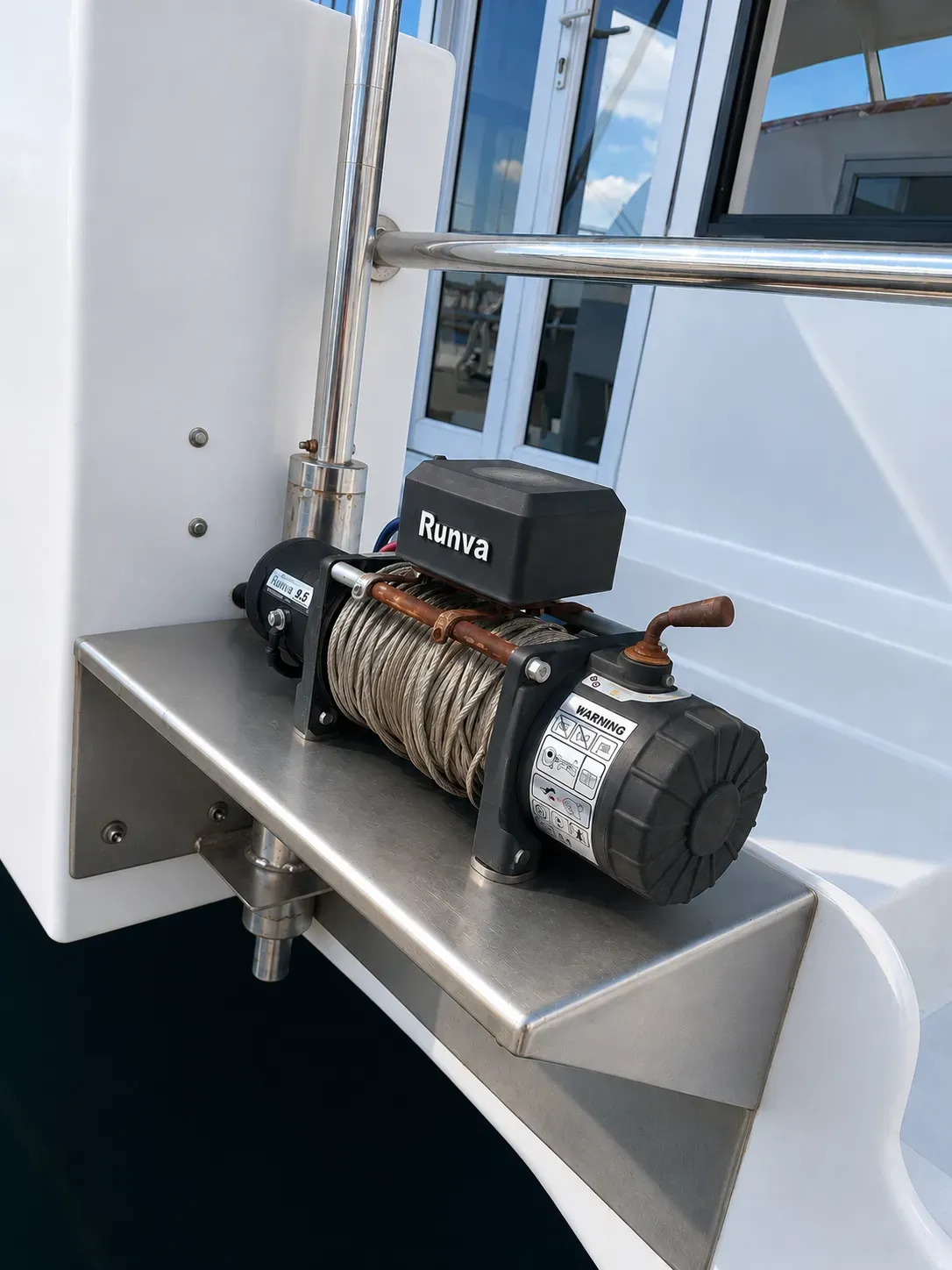 Runva electric winch mounted on a stainless-steel support frame on the deck of Vaquita.